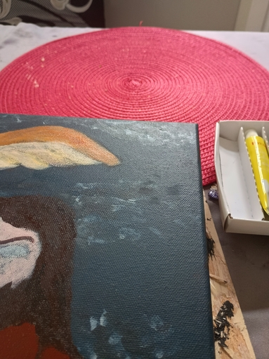 A partial view of my painting, an imprint of a cat's paw is visible