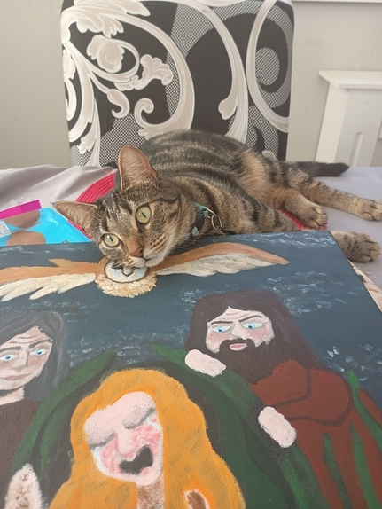A partial view of my painting, with a tabby cat resting her head on it!