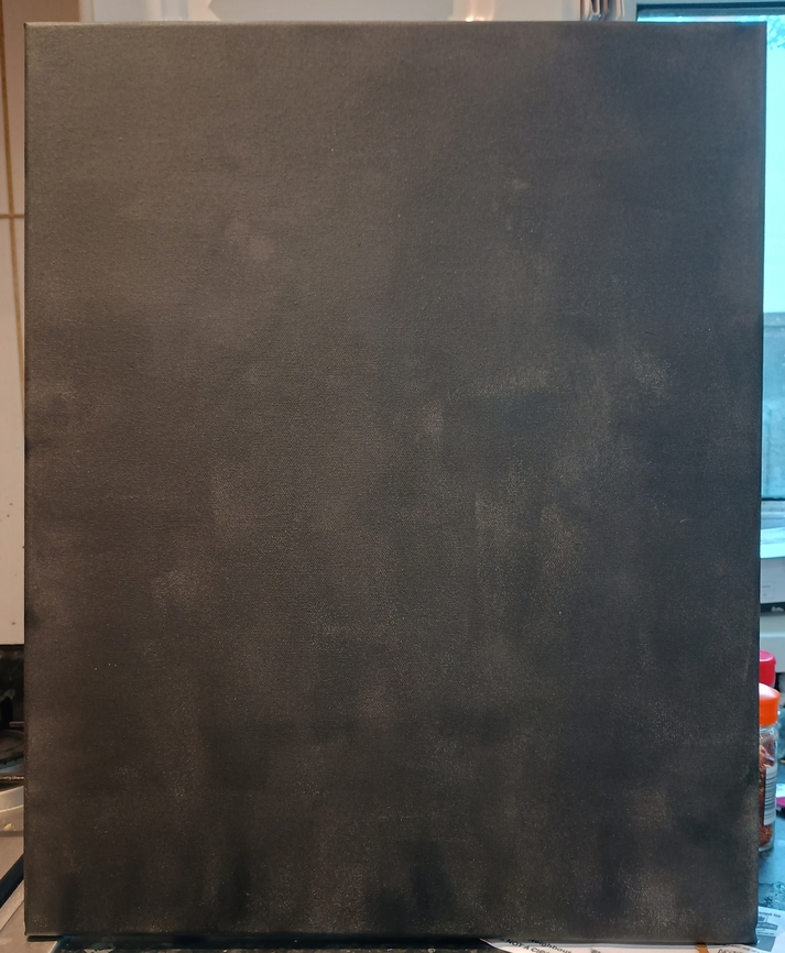 An A2 sized canvas, painted black (it is slightly patchy in colour)