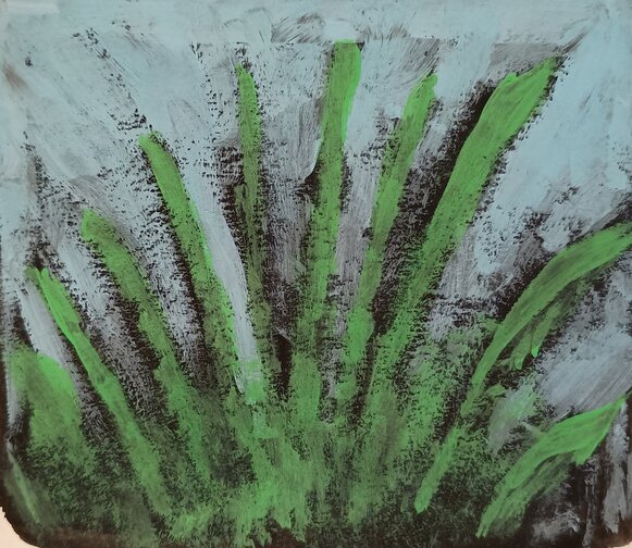 Green grass and a blue sky with black shadows seeping through